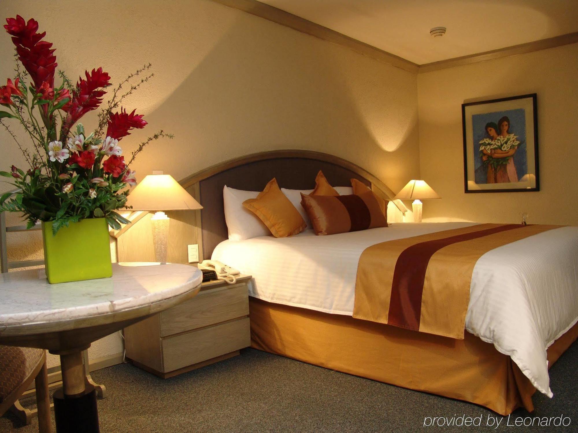 래디슨 파라이소 호텔 멕시코 시티 객실 사진 A bedroom at the hotel